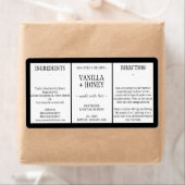 ブラックエッセンシャル油コスメティックボトルラップのまわりに ラベル (インサイチュ)