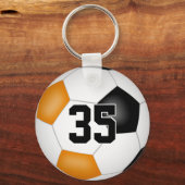 ブラックオレンジ色のサッカーチームの女の子をプレゼント キーホルダー (裏面)
