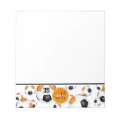 ブラックオレンジ色のサッカーボールのパターン ノートパッド (正面)