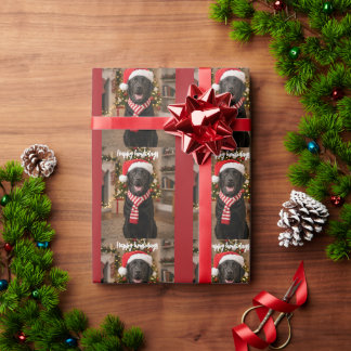 ブラックラブラドールの足跡 Happy Howlidays デザイン ラッピングペーパー