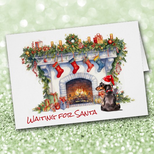 ブラック・ダシュント・ドッグがサンタ・暖炉を待つ