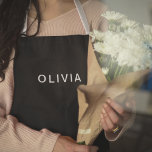 ブラック&ネームパーソナライズされたモノグラム | エレガント エプロン<br><div class="desc">黒い背景とカスタマイズ可能な名前のモノグラムを備えたエレガントこのエプロンでパーソナライズされた、スタイルで調理師、焼きお洒落またはグリル。このエプロンは機能性と洗練を兼ね備えたホームシェフ、ベーカース、BBQ愛好家に最適。丈夫な生地と調節可能なストラップで作られ、心地よいと保護を提供しながら料理を泡立てお気に入りのる。料理ファンへの思いやりある贈り物でも、キッチンへの追加でも、このエプロンは実用スタイリッシュ的なものだ。今すぐパーソナライズして真のユニークtouch!</div>