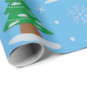 ブルーの背景に雪の降る緑のクリスマスツリー ラッピングペーパー (ロールコーナー)