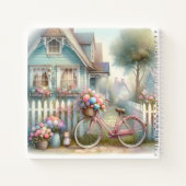 ブルーコテージの門にあるピンクの花の自転車 ノートブック (裏面)