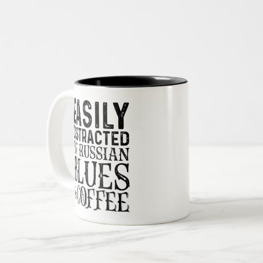 ブルースやコーロシアのヒーに気を取られる ツートーンマグカップ (正面左)