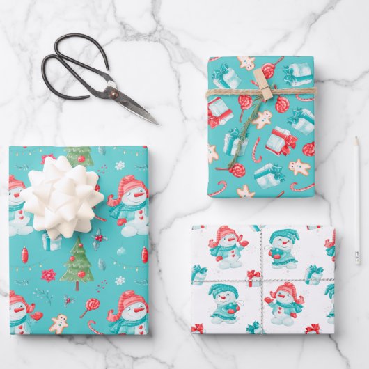 ブルーピンクのおもしろい雪だるまパターン子供のクリスマス ラッピングペーパーシート (正面)