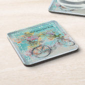 ブルーラップにフラワーバスケットを付けた自転車 コースター (左側)