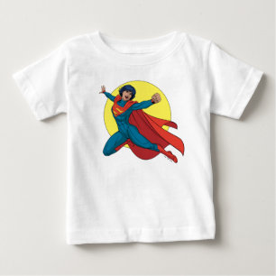 ブルー飛んでいるスーツのスーパーガール ベビーTシャツ