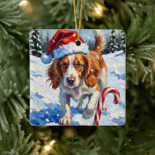 ブrittanyスパニエルがクリスマスのキャンディを指差す セラミックオーナメント
