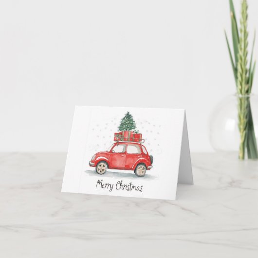 プレゼントが積まれた赤いクリスマスカー　その上には木が、 カード (正面)