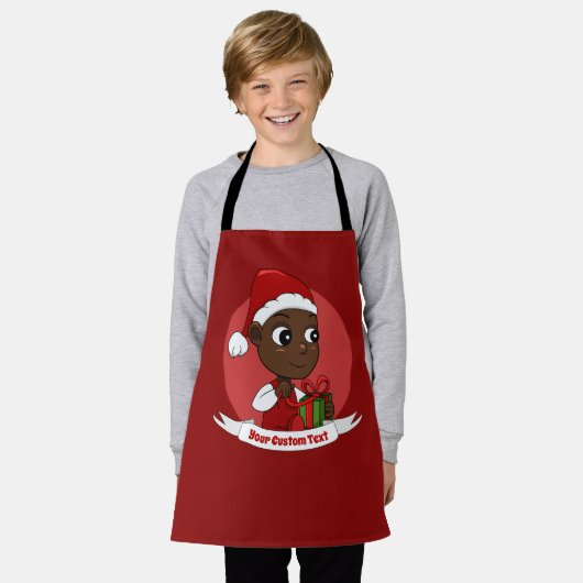 プレゼントとサンタの帽子が付いた可愛いクリスマスベビー エプロン (着用した状態)