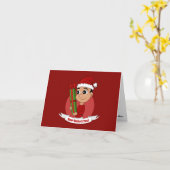 プレゼントを持ったかわいいクリスマスの少年 カード (黄色い花)