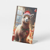 「プレゼントを贈るアルパカ：クリスマスの物語」 台座サイン (正面)