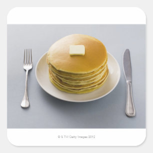 プレートのバターが付いているパンケーキの積み重ね スクエアシール