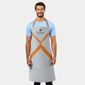 プロモーション会社のロゴ名オレンジアクセント灰色 エプロン (着用した状態)