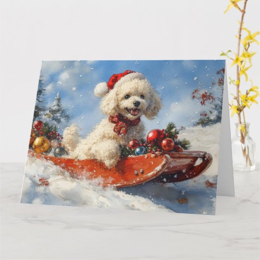 プードル犬のそりで雪を降らせて クリスマス カード (黄色い花)