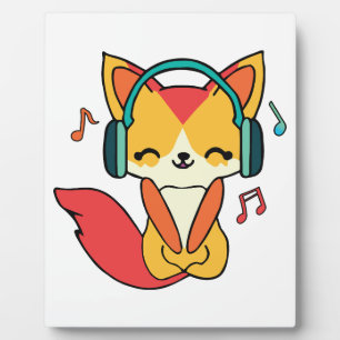 ヘッドフォンと幸せ聞なフォックス音楽。 フォトプラーク