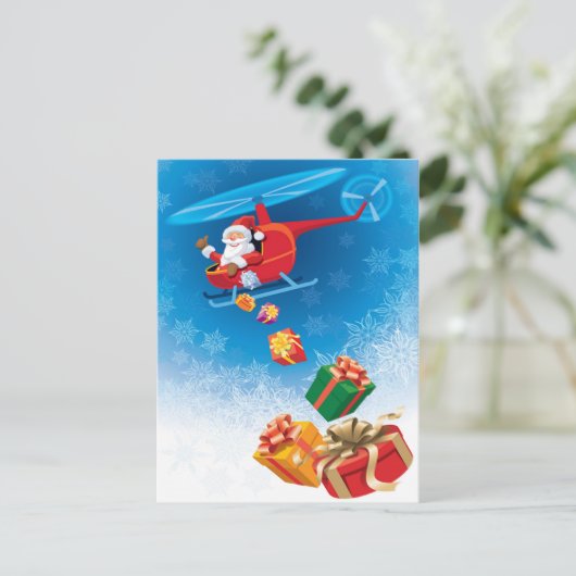 ヘリコプターから贈り物を投げるサンタクロースおもしろい シーズンポストカード (スタンド正面)