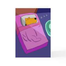 ベッドのグリーティングカードの子犬