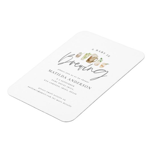 ベビーが水色のビールベビーシャワーを浴びている。 マグネット (左側)