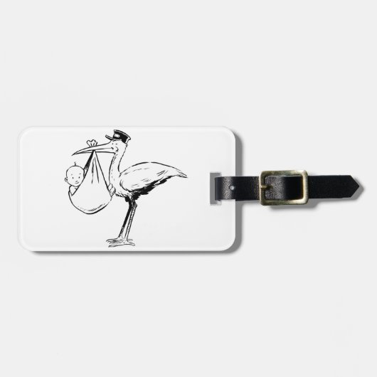 ベビーの荷物のラベルを握っているこうのとり ラゲッジタグ (正面横)