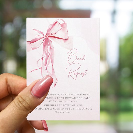 ベビーガールの赤ちゃんシャワーのためのピンクの弓の本 エンクロージャーカード