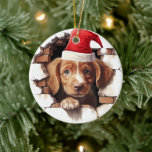 ベビーパピーin Santa Hat - 3D セラミックオーナメント<br><div class="desc">サンタハットレンガの壁のクリスマスオーナメントで作られたベビーの子犬とクリスマスの木に休日の応援の心温まるtouchをもたらす。 小さなサンタ帽をかぶった素朴なレンガの壁を遊び心から覗き込む子犬の初めてのクリスマスの無邪気さと喜びを捉えた可愛いフェスティバルオーナメント。私たちの才能ある職人は、この愛らしいクリスマスの装飾を慎重に作成し、あなたの休日の装飾や愛犬家のための思いやりのある贈り物に完璧な追加を作った。各オーナメントはレンガの壁の質感に子犬のきらめく目を示す。この魅力的オーナメントは気に詳細に注目して作られ、何年にもわたって大切な休日の伝統の一部に確実に来なる。それは来耐久性のコードとぶら下がった、あなたの木を優雅にしたり、あなたの家に休日の精神のtouchを追加する準備ができている。</div>