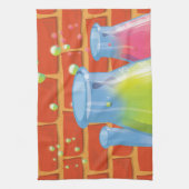 ベンチに置かれた漫画のガラス科学機器 キッチンタオル (縦)