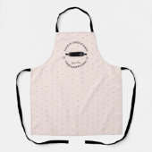 ベーカーのカップケーキロゴピンク黒の製品ラベル エプロン (正面)