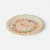 ベージュの背景とフローラリース ペーパープレート (アングル)