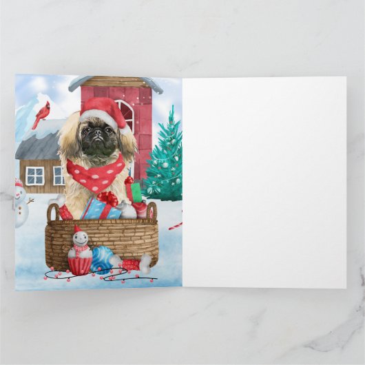 ペキニーズの犬が雪のクリスマス犬小屋にいる カード (内部)
