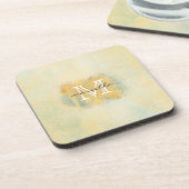 ペンキによってブラシをかけられる黄色いモノグラム コースター (左側)