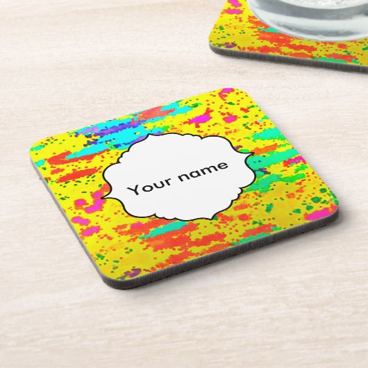 ペンキは黄色い背景ではねかけます コースター (左側)