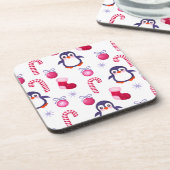 ペンギンが登場する可愛いピンク&ホワイトのクリスマスパターン コースター (左側)