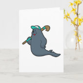 ホッケーでホッケースティックを持つアザラシ カード (黄色い花)