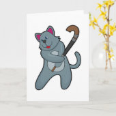 ホッケーでホッケースティックを持つ猫 カード (黄色い花)