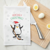 ホッケーのクリスマスのペンギンのサンタの帽子の雪片 キッチンタオル (四つ折り)
