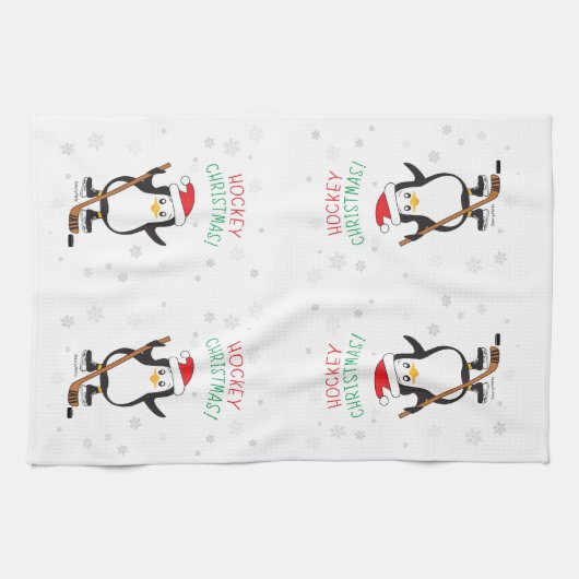 ホッケーのクリスマスのペンギンのサンタの帽子の雪片 キッチンタオル (横)