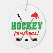 ホッケークリスマスホッケーサンタハットを貼る セラミックオーナメント (左)