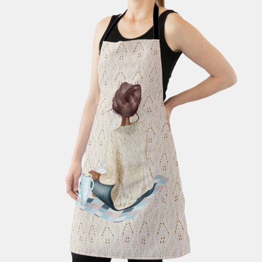 ホットドリンク付き毛布に座っている女性 エプロン (インサイチュ)