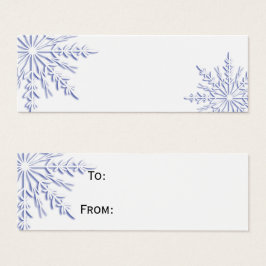 ホワイトギフトの上に青い冬の雪の結晶ラベル