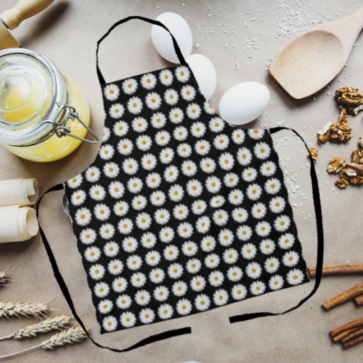 ホワイトデイジーフローラルパターンオンブラック エプロン