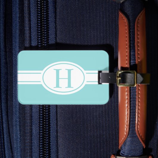 ホワイトバンド楕円形シールドライトブルーモノグラム ラゲッジタグ (正面インサイチュ4)