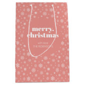 ホワイトピンクのメリークリスマススノーフレークパターン ミディアムペーパーバッグ (正面)