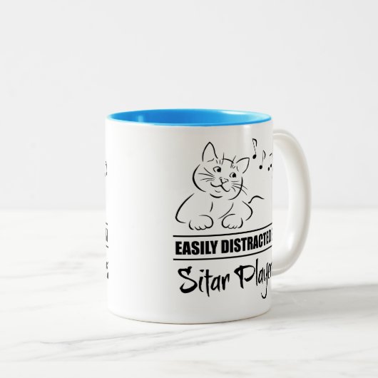 ホームプレーヤーに気づかれやすい不思議な猫 ツートーンマグカップ (正面右)
