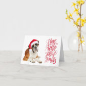 ボクサー犬サンタ帽子でハッピーなクリスマス カード (黄色い花)