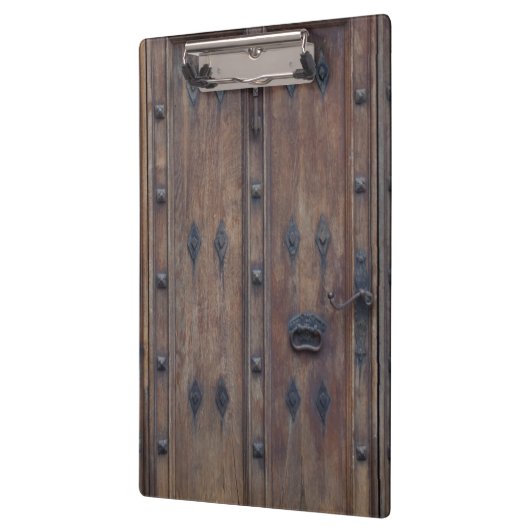 ボルトが付いている古くスペインのな木のドア クリップボード (左)