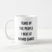 ボードゲームで負かした人々の涙 コーヒーマグカップ (左)