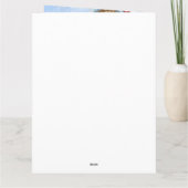 ポメラニアンの犬が雪のクリスマス犬小屋にいる カード (裏面)