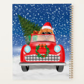 ポメラニア犬の犬が雪のクリスマスに車を運転 プランナー手帳 (裏面)